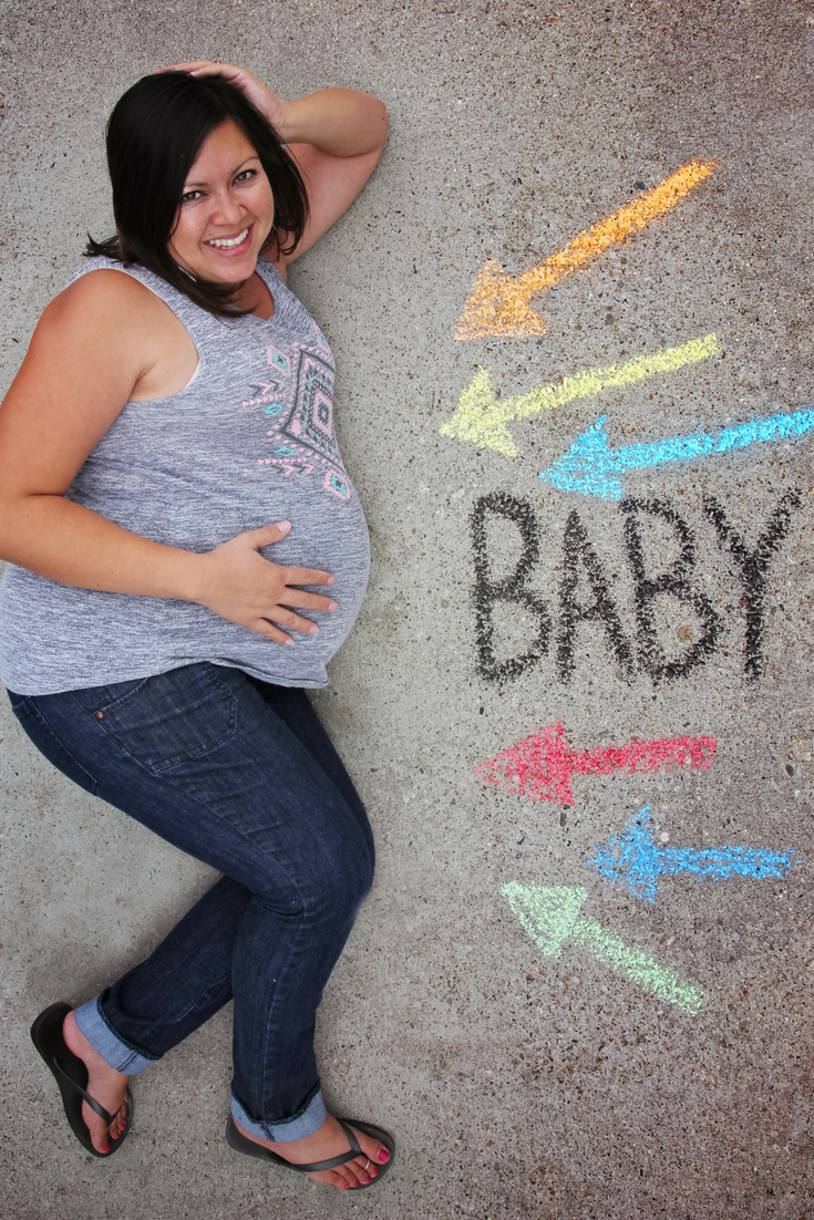 Plus size pregnant woman lying down and posing