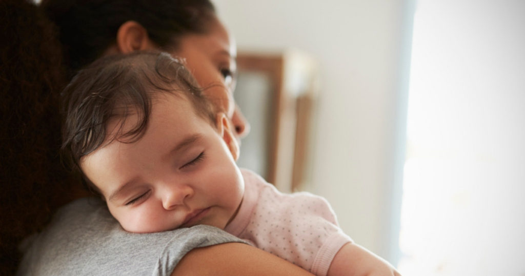 Plus size mom holding child