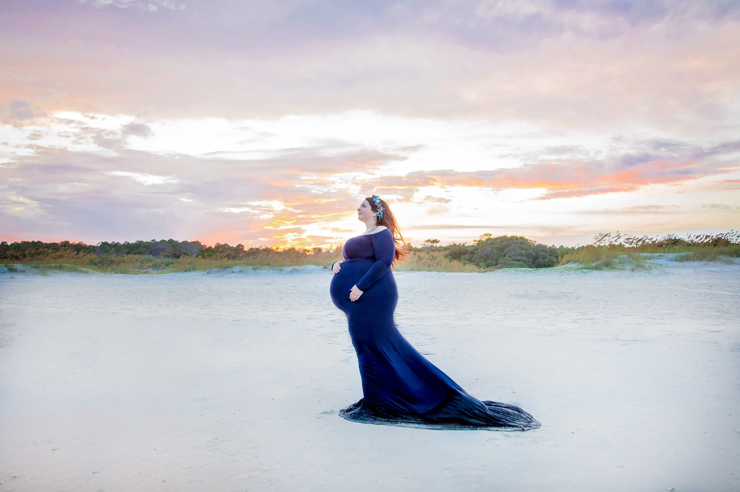 Courtney posing on the beach during sunset