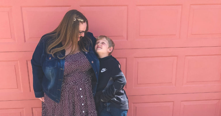 Plus size mother and son hugging