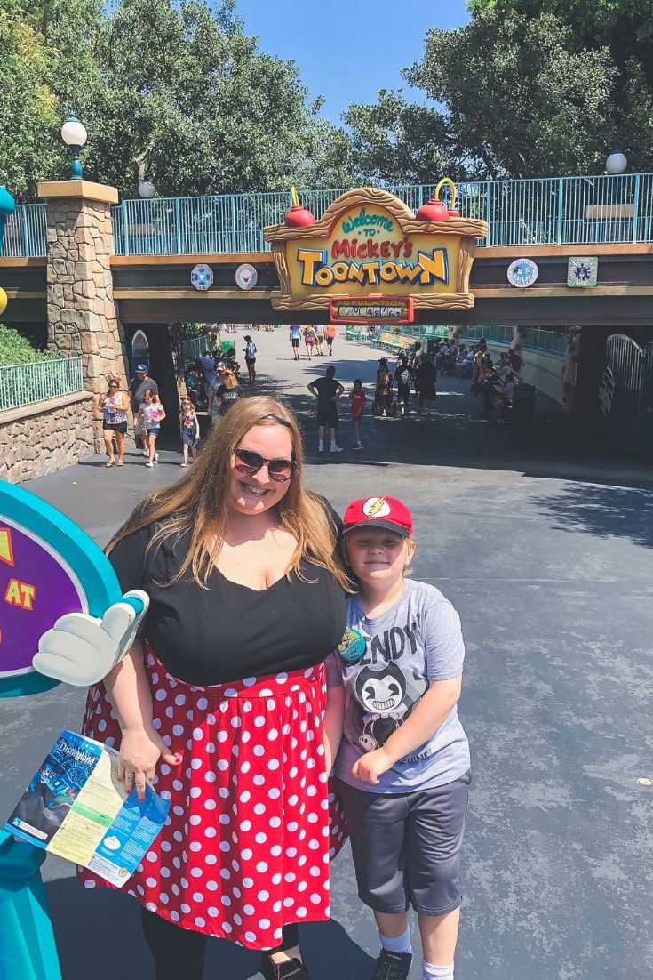 Jen McLellan and her son in front of the entrance of Toon Town 