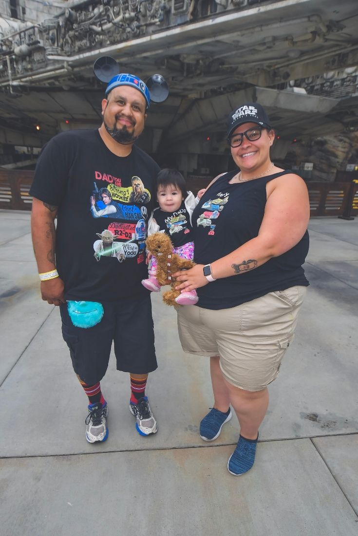 Picture of Sam Reyes and her family in front of a Star Wars attraction