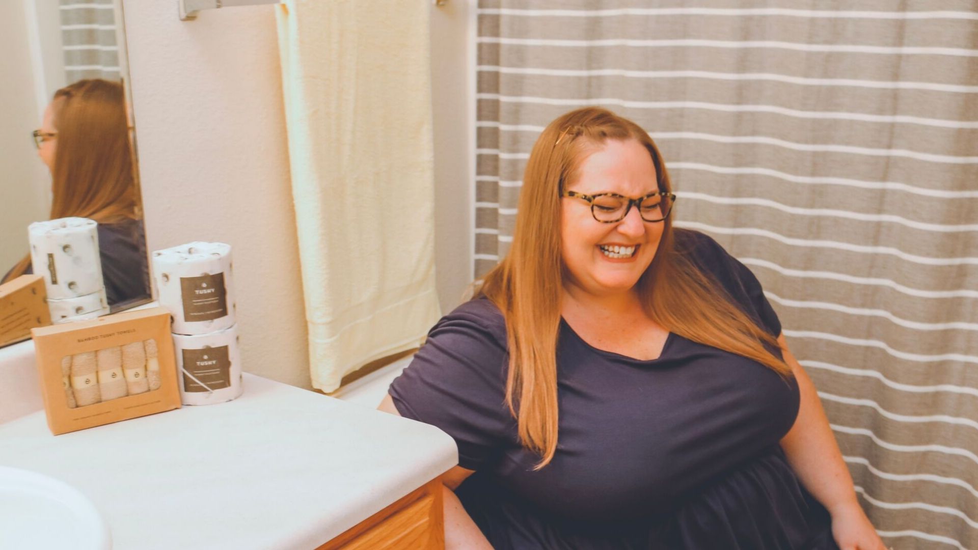 plus size woman using TUSHY bidet