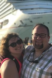 Picture of  Jimmy and Amanda of Chubby And Away in front of a cruise ship