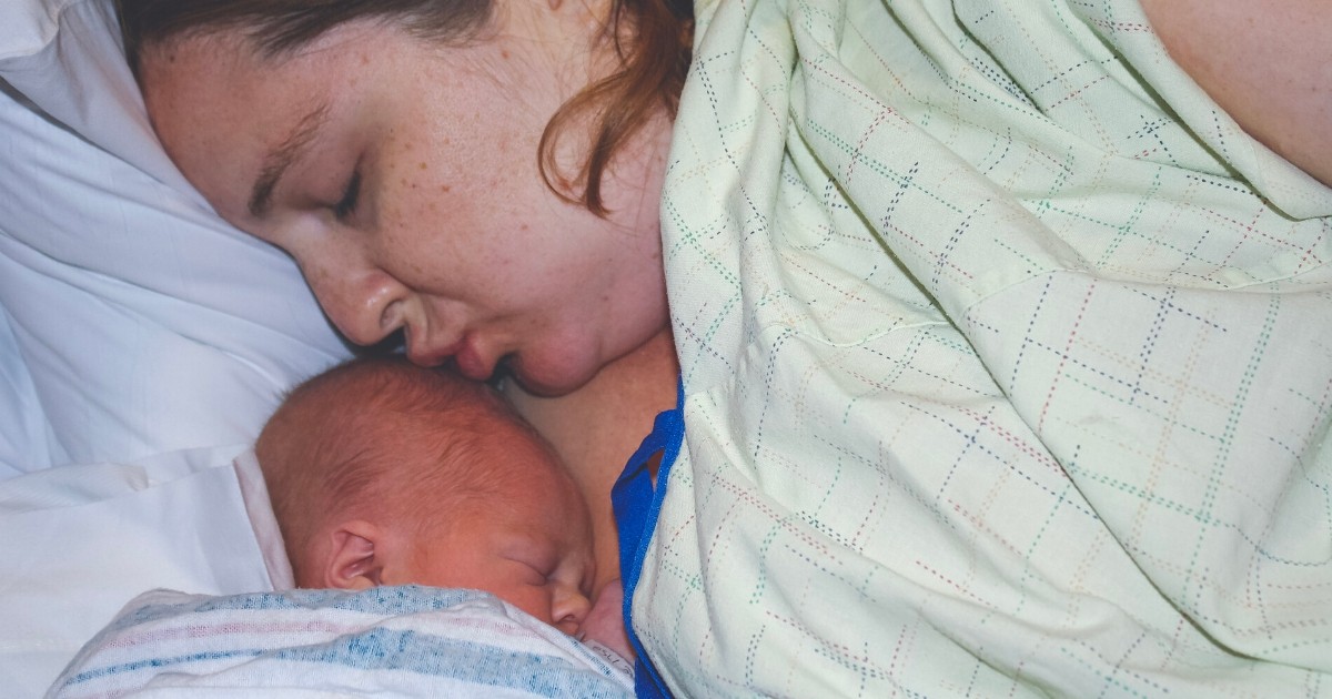 plus size mom after giving birth with newborn