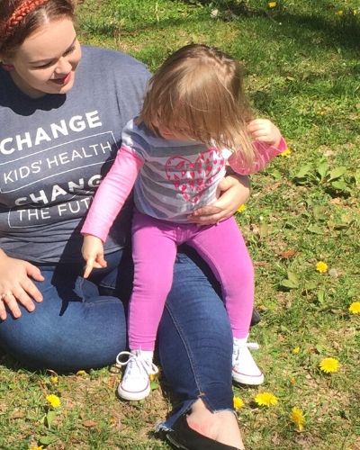 Kat Stroud sitting with her daughter