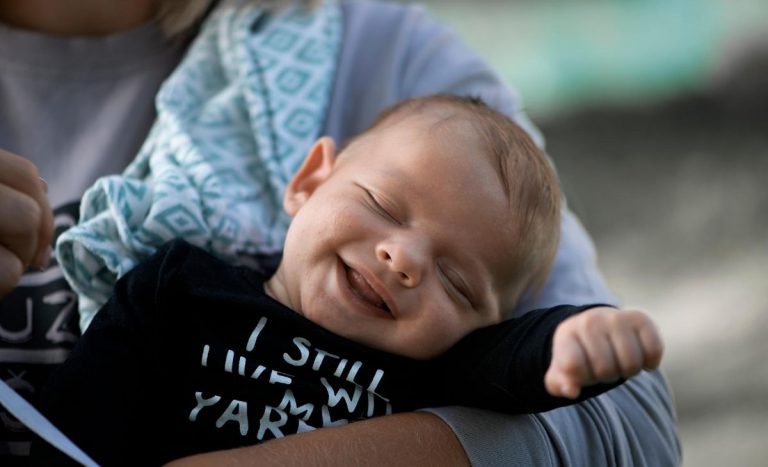 plus size mom holding baby