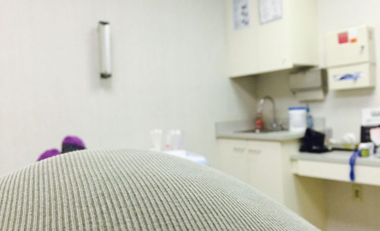 plus size woman laying on exam table