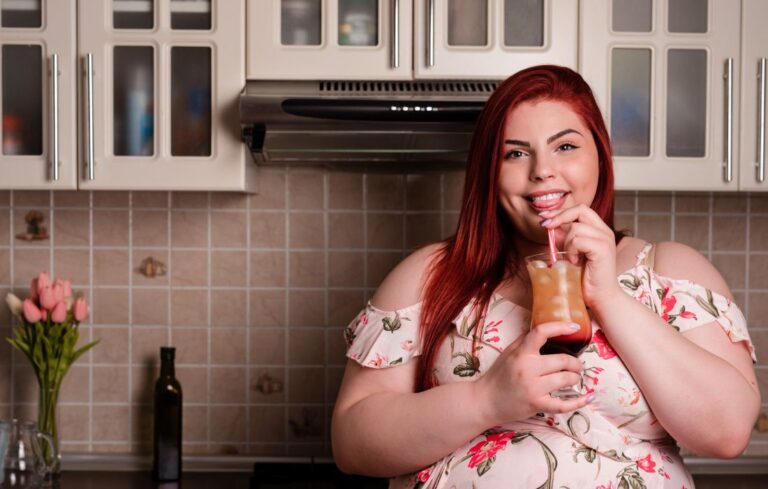 plus size woman drinking a drink