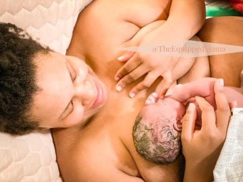 plus size woman after giving birth at home laying in bed with baby on chest