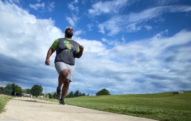 plus size man running outdoors