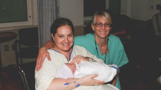 Unmedicated Hospital Birth plus size woman and midwife
