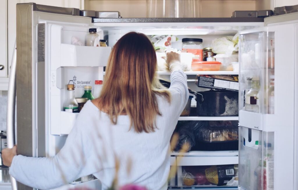 teen getting into the refrigerator