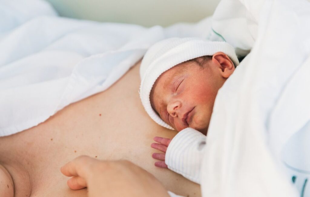 newborn laying on mom's chest after childbirth