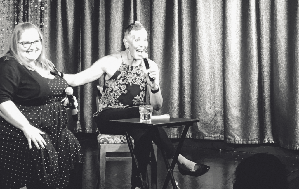 Debbie Scheer and Jen McLellan on stage for comedy show