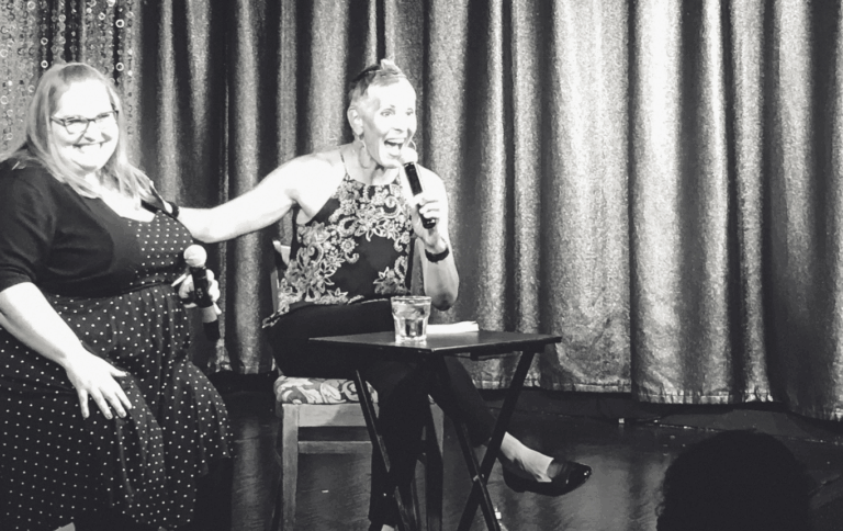 Debbie Scheer and Jen McLellan on stage for comedy show